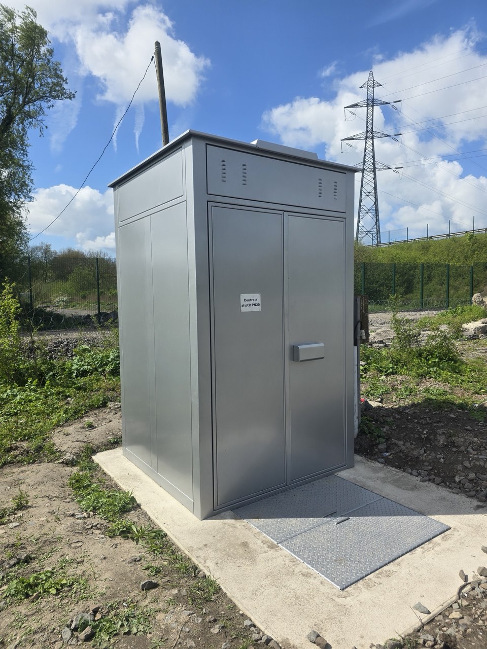 SafeBox AV enclosure on its slab beside the running line